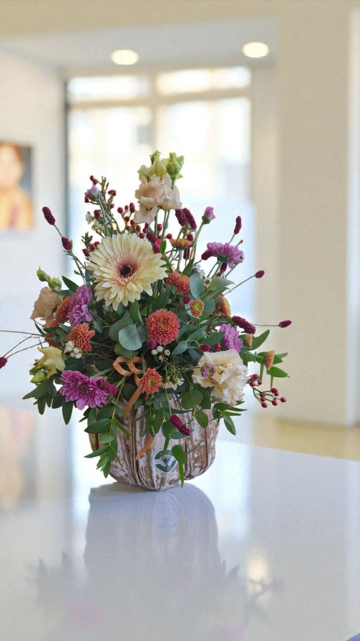 Champagne velvet pumpkin with fresh flower arrangement