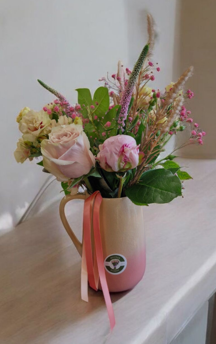 Delicate summer vase including peony roses