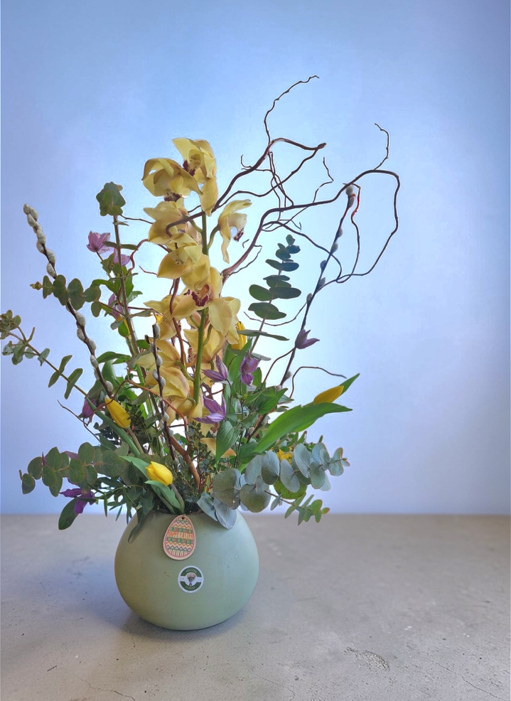 Luxury orchid, tulip and clematis glass vase arrangement